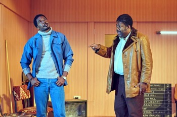 Jitney Production Image. Doub (Geoff Aymer) points at Youngblood (Solomon Israel) who looks away.