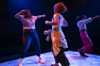 Annie (Saroja-Lily Ratnavel), Flo (Jessica Clark) and Bel (Ruby Crepin-Glyne) dancing on the stage.